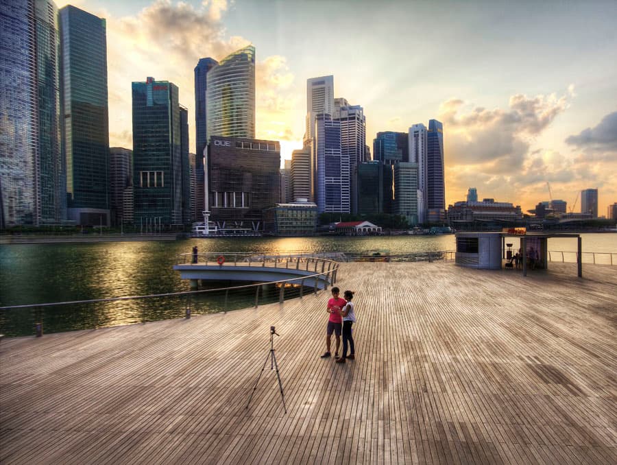Singapore's Central Business District skyline at dusk, seen across Marina Bay